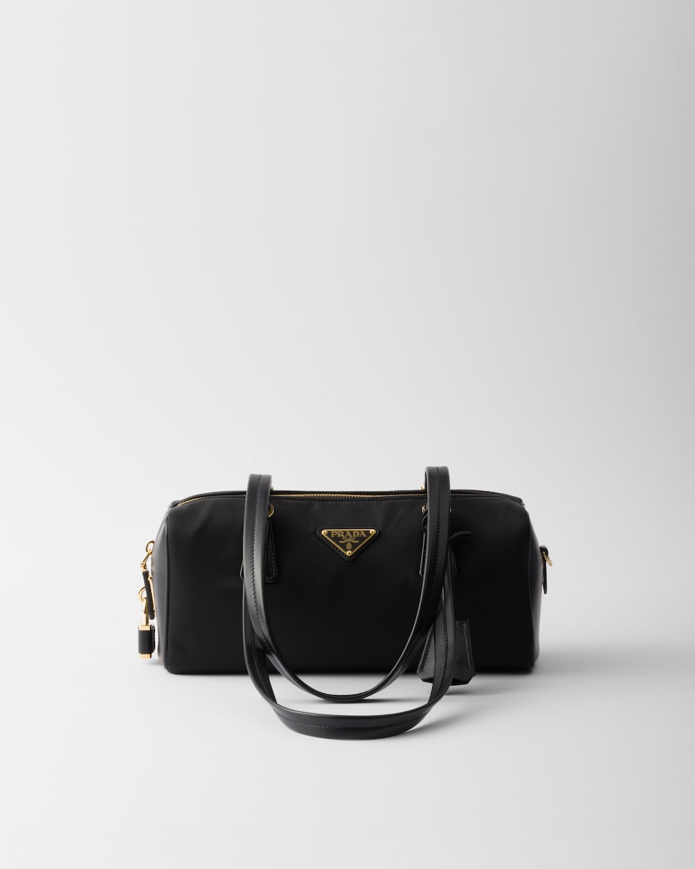 Re-Nylon and Leather Medium Top-Handle Bag With Padlock - Image 1